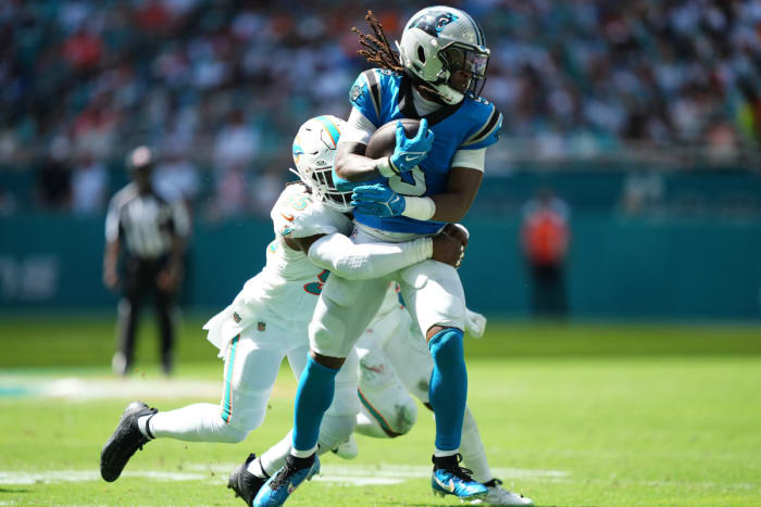 Miami Dolphins linebacker Jerome Baker (55) tackles Carolina Panthers wide receiver Laviska Shenault Jr. (5) during the first half at Hard Rock Stadium.